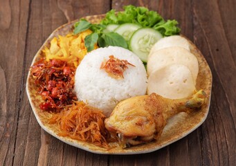 Nasi uduk is a dish made from diaroned white rice steamed with coconut milk, and seasoned with nutmeg, cinnamon, ginger, lemongrass leaves and pepper, which is popular in Betawi dishes