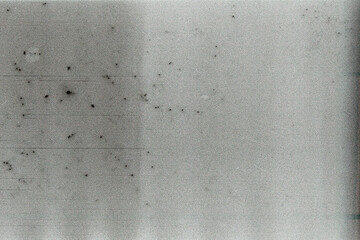 Blank grained film strip texture background with heavy grain, dust and light leak