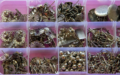 Furniture, beads for diy A collection of decorative pins displayed in compartments, ideal for...