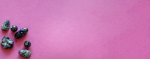 Furniture, beads for diy A vibrant pink surface adorned with shiny stones, perfect for celebrations or decor.