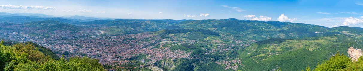 Wide panoramic view of Sarajevo and surrounding Dinaric Alps from Mount Trebevic in Bosnia and Herzegovina