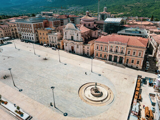 Italy, July 4, 2025: Panoramic aerial view, from the drone, of the Piazza del Duomo in L'Aquila in Abruzzo. Here you can breathe peace and tranquility and history.