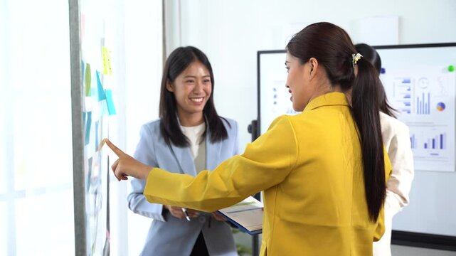 Collaboration and Strategy: A dynamic work scene showing focused professionals actively discussing strategic plans, sharing ideas, and working toward a common goal, fostering productivity.