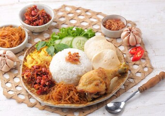 Nasi uduk is a dish made from diaroned white rice steamed with coconut milk, and seasoned with nutmeg, cinnamon, ginger, lemongrass leaves and pepper, which is popular in Betawi dishes