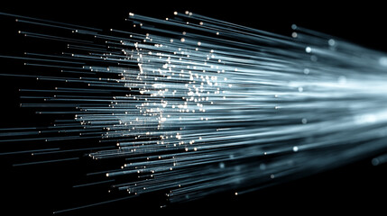 Fiber optic cables glow with light transmitting data in a network communication system.