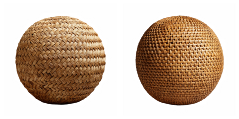 Two woven spheres of different patterns against a stark black background studio shot