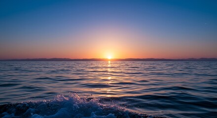 Golden Sunset Over Calm Ocean Waters with Gentle Wave Action