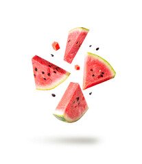 Watermelon pieces isolated with ceeds flying isolated on white. Falling slices set.