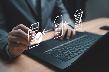 Businessman using electronic pen sign tick mark on virtual document for online approve paperless quality assurance and ERP management , Prepare check and approve document concept.