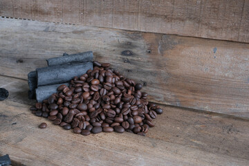 Coffee beans on a wooden background