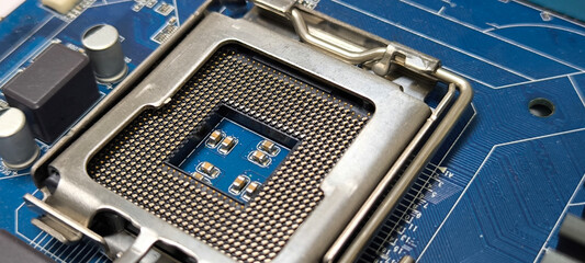CPU socket in computer on blue motherboard