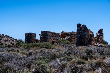 ancient Greek mills against a Mediterranean landscape on the island of Crete
