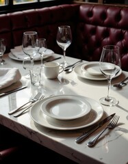 Elegant restaurant table setting with wine glasses on a sunny day