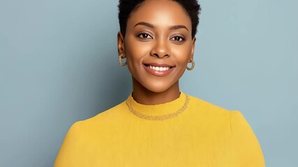 Portrait of a smiling african american woman holding a color palette, isolated on a blue background - Powered by Adobe