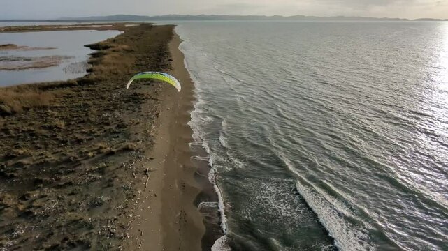 Powered paragliding paramotor flying over Albanian coast mountains and beaches aerial panorama landscape view,Albania,Balcan