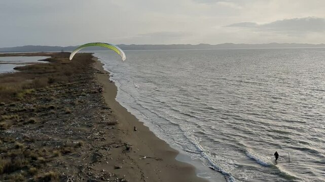 Powered paragliding paramotor flying over Albanian coast mountains and beaches aerial panorama landscape view,Albania,Balcan
