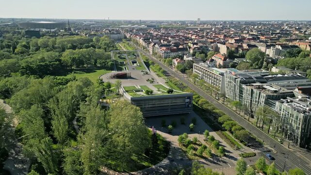 Drone video zooming out from the Museum of Ethnography, revealing City Park and Pusk&aacute;s Ar&eacute;na in soft morning light with a wide aerial view of Budapest&rsquo;s cultural district.  