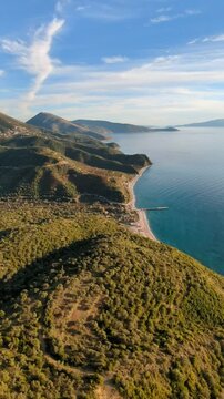 Powered paragliding paramotor flying over Albanian coast mountains and beaches aerial panorama landscape view,Albania,Balcan