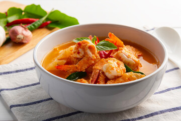 Red curry Pineapple and shrimp in white bowl.(Kang Kua Subpharod Kung) Thai food.