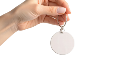 Blank round keychain held by hand with natural nails on transparency background