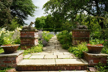 Newby Hall and Gardens, North Yorkshire, England – July 15 2023: Serene garden pathway with brick...