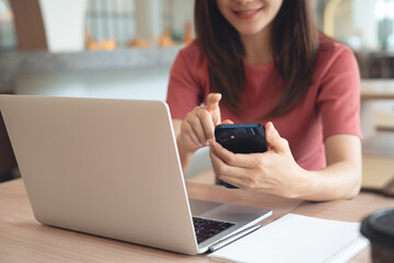 Close up of asian business woman in casual clothes using smartphone for video call, online meeting...