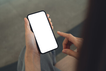 Close up, cell phone blank screen mockup. Woman hand holding, using smartphone with blank white...