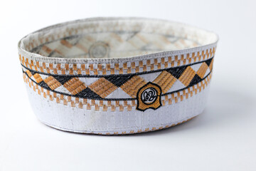 White peci or songkok is made from woven white thread as a complement to Islamic clothing style