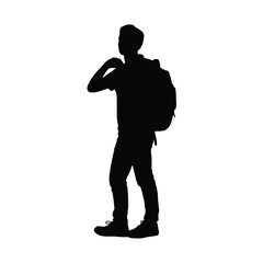 Silhouette of a young man wearing a backpack and adjusting his shirt