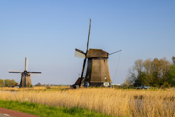 Traditional Dutch windmills standing in Heerhugowaard, North Holland