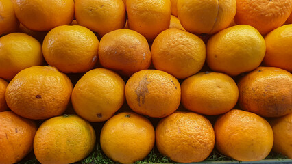 Fresh and vibrant pile of oranges creating a visually appealing display of citrus fruits
