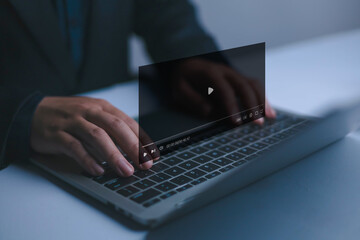 Video streaming on internet concept, Businessman ues laptop to watching and live streaming window,...