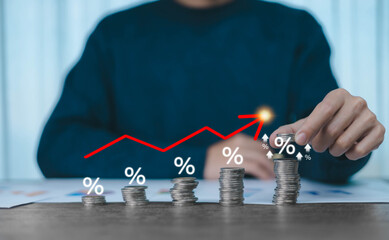 Interest rate and mortgage rates concept. Adjusting interest rates, A man is placing coins at an increasing percentage rate, raising interest rates to fight inflation, returns on investments. percent