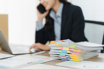 Work and Communication: A focused professional, engrossed in a phone call, finds herself amidst a...