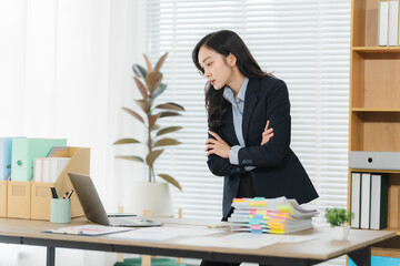 Focused Businesswoman: Captivating image of a businesswoman deeply engrossed in her work,...