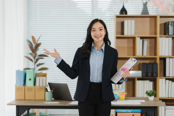 Professional Presentation: A confident business woman, dressed in professional attire, stands at...