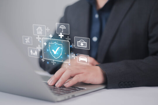 Insurance and safety protection concept. Businessman show icon in front the laptop, Certification of various types of insurance services. healthcare, investment, Car Insurance, health family insurance