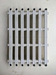 Top down flat lay of a white plastic modular shelf component isolated on a white background. Framework and structure concept.