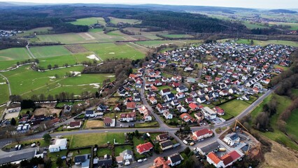Aerial view of the downtown around the city L&ouml;schenrod in Hessen, Germany on a cloudy day. in autumn	