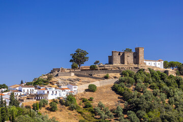 Cortegana Castle dominating the skyline of Cortegana village in Andalucia, Spain