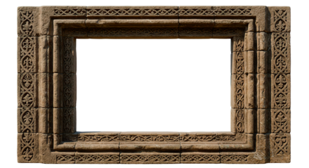 Intricately carved stone window frame isolated on a black backdrop, showcasing aged artistry.