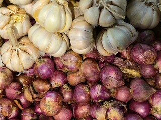 Close Up Stack of Fresh Garlic and Red Onion Still Life