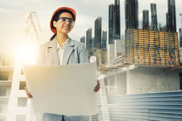 Engineer with draft and unfinished buildings, multiple exposure