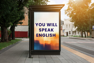 You Will Speak English text on advertising board in city. Language course