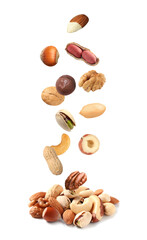 Peanut and other nuts falling on white background