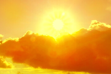 Fototapeta premium Orange sky with clouds during hot summer weather