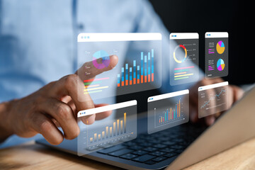 Data analyzing and stock market visualization with digital charts, financial dashboards, and...