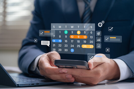 Time management and digital workflow concept. Businessman using smartphone calendar app to manage task, plan schedules, set reminder and track productivity with AI automation helping monitor progress.