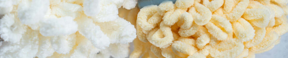 Fluffy yarn. Colored threads in reels. Knitting hobby embroidery