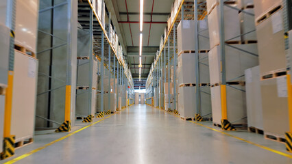 Fototapeta premium In a vast warehouse, industrial operators manage global supply chains. Low-angle shots capture towering shelves filled with cargo, symbolizing efficiency and the intricate dance.